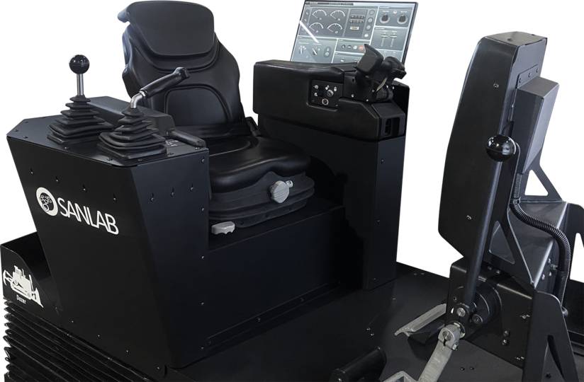 This image provides a close-up view of the control seat layout in a dozer simulator. The ergonomic seat, upholstered in black leather, features two control levers. In front of the seat, a digital instrument panel and a section with various controls are visible.