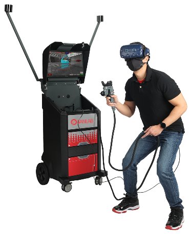 A person wearing VR glasses and holding a paint gun receives training with the Sanlab paint simulator.