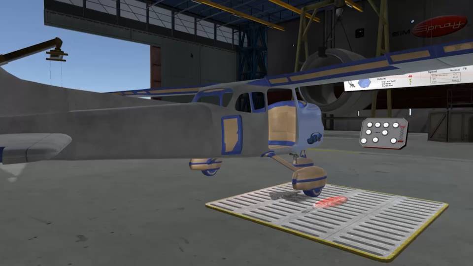 Semi-assembled aircraft fuselage and painting equipment prepared to be painted in the paint simulator.