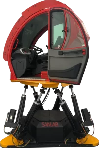 A red telehandler motion simulator featuring a vehicle cabin mounted on hydraulic legs.